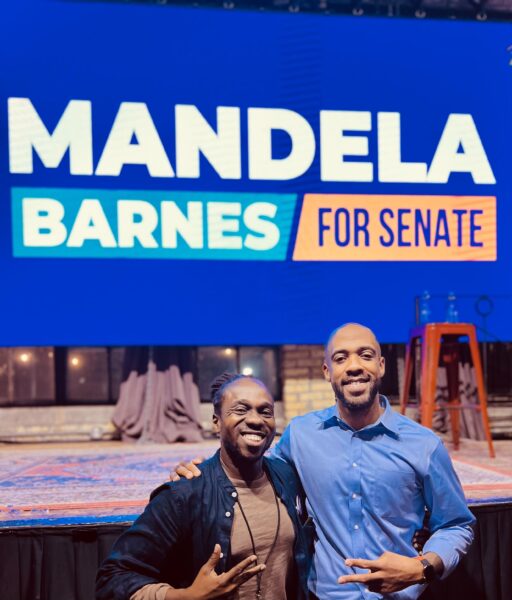 Photo of Mandela Barnes and WFP Director Maurice Mitchell in front of a Mandela Barnes for Senate sign.